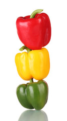 fresh green, red and yellow paprika isolated on white