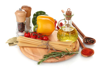 spaghetti, jar of oil, spices and vegetables