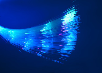 Fiber optics background with lots of light spots .