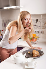 Pregnant woman eating pie