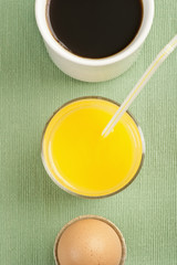 Breakfast with egg, orange juice and coffee