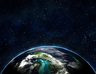 blue earth in space with rising sun