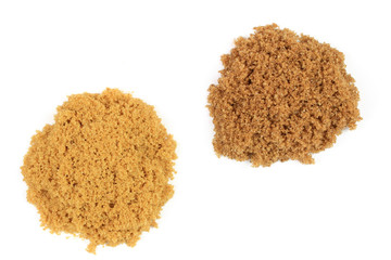 Two types brown sugar on pails.
