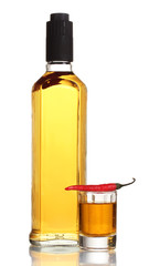 bottle and glass of pepper vodka and red chili pepper isolated