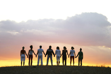 Group of People sharing meditating silhouette