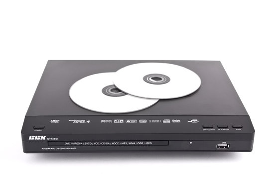 Black dvd-player and discs isolated
