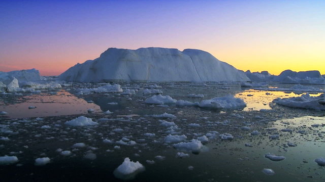 Sun Setting over Icebergs 