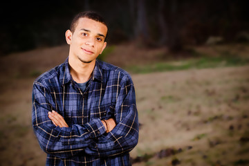 Naklejka na ściany i meble Portrait of African-American teenager outdoors