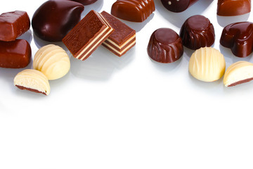 Many different chocolate candy isolated on white