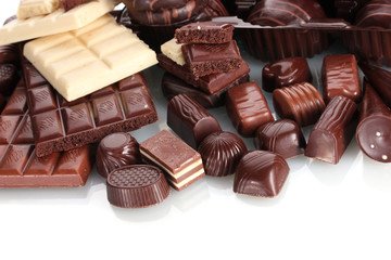 Many different chocolate candy isolated on white