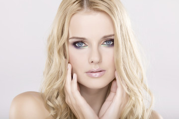 Naklejka premium Young pretty woman with beautiful blond hairs