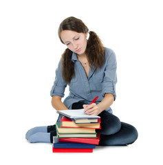 The beautiful girl with books isolated on white