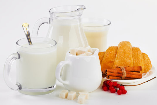 Milk in a cup with croissants