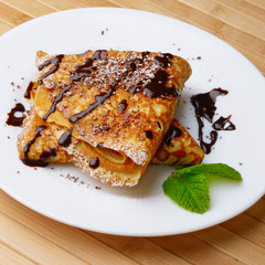 Crepes with chocolate sauce
