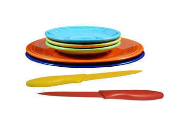 vintqge fiesta-ware with knifes on a white background