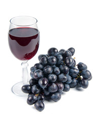 glass with wine and grapes