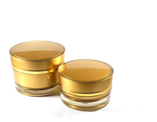 two gold bottles for cosmetic