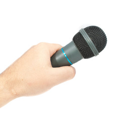 Karaoke microphone in hand. Isolated on white background.