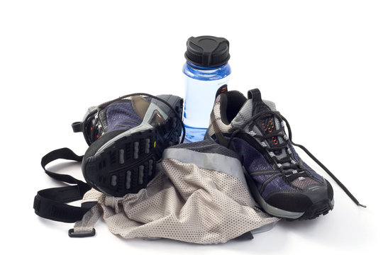 sneakers with water bottle and reflective vest