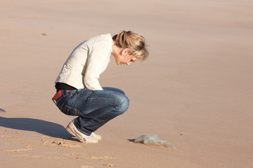 Woman and jellyfish at the beach © marinaphoto