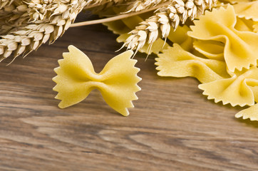 Butterfly italian pasta close up on wood table