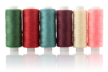 thread on reel coloured isolated on white background