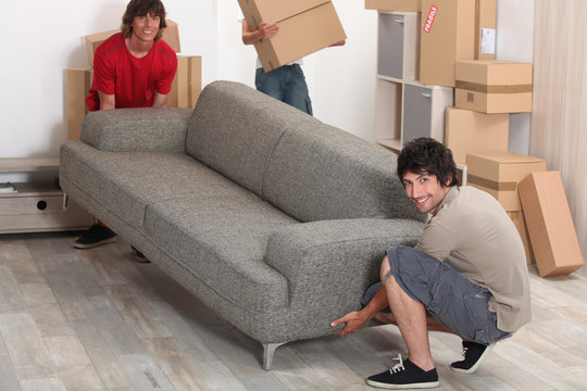 Picture Of Friends Moving A Couch