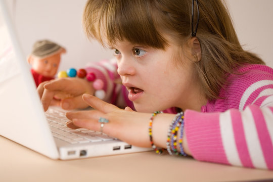A girl using a laptop.