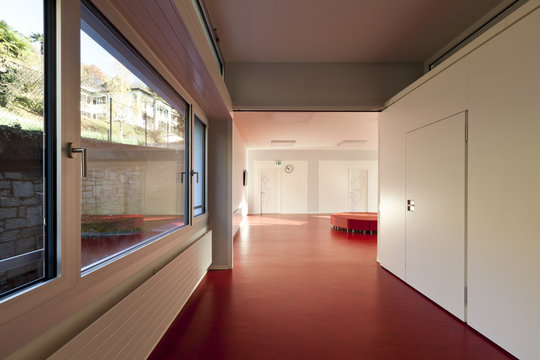 modern public school, corridor red floor