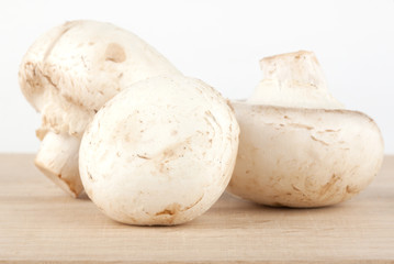 Fresh mushrooms on the wooden breadboard