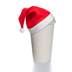 Obraz na płótnie Canvas paper coffee cup with santa hat