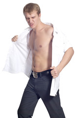 Fototapeta premium Young handsome male model in white shirt posing