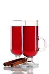 mulled wine in the glasses and cinnamon isolated on white