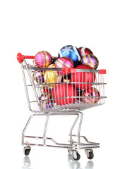 Beautiful bright Christmas balls in the cart isolated on white