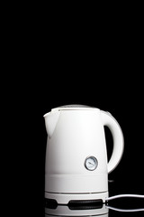 White electric kettle on black