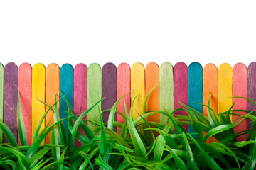 Colorful toy fence and grass