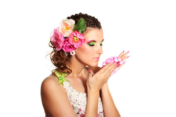 Beautiful girl with flowers in her hair isolated