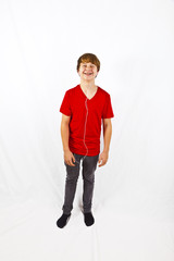 Fototapeta premium happy boy listening to music via earphone