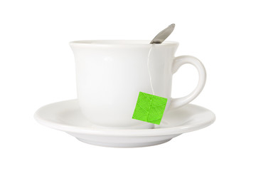 white tea cup with green leaf label