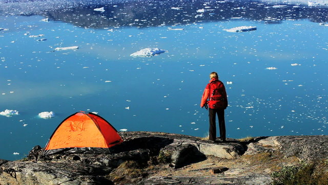 Female Hiker With Tent by Arctic Water