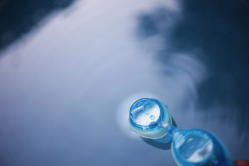 Swiming glasses floating on water