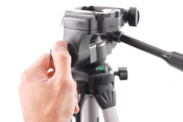 Hand Securing a Swivel Lock on Tripod