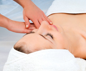 woman receiving facial massage