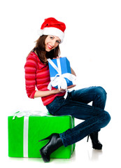 girl in Santa hat with gifts