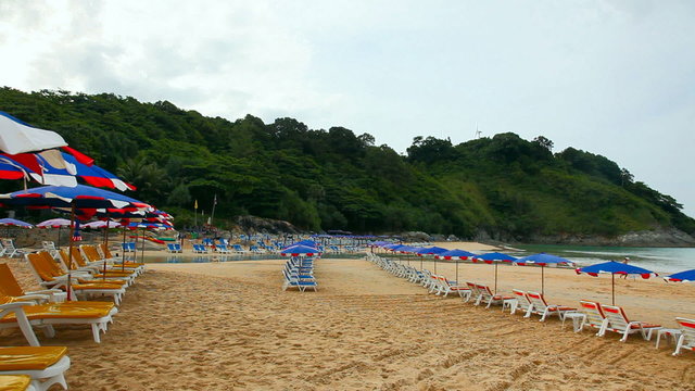 Sandy beach with Loungers and Umbrellas.