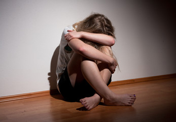 Fototapeta na wymiar Depressed young lonely woman