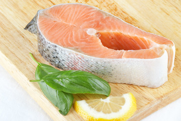 A piece of salmon on a cutting board