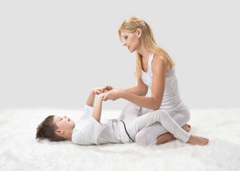 Fototapeta na wymiar Mother and son do yoga before bed