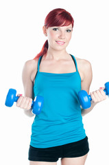 Young woman exercising with dumbbells, white background