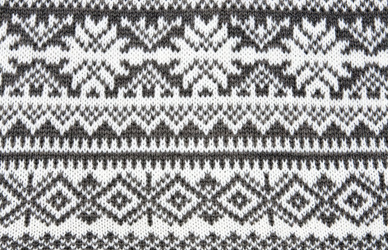gray background with a knitted pattern